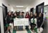 Kennedale Education Foundation Awards $25,000 in Grants to KISD Educators Cheerleaders and grant winner with a giant check